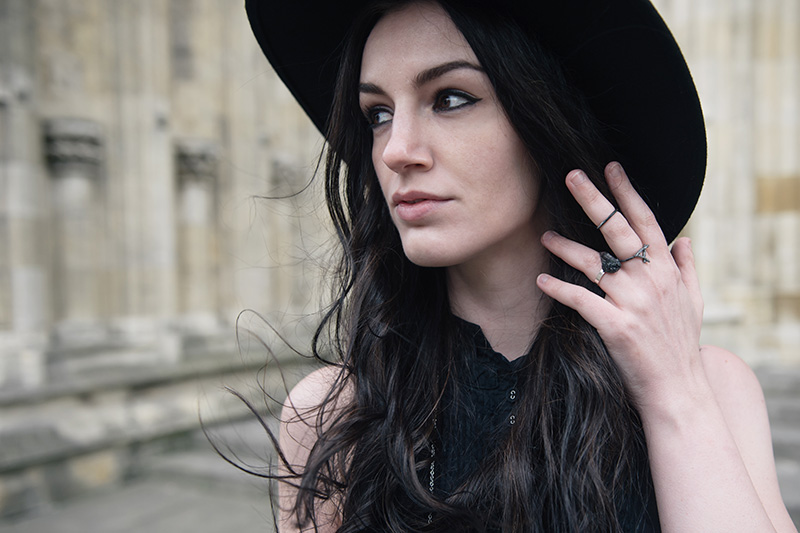 Fashion blogger Stephanie of FAIIINT wearing Catarzi wide brim fedora, Hvnter Gvtherer Kindling & Lumen rings, Elemental Luxury Tibetan Black Phantom Quartz Ring, Allsaints shirt. All black everything outfit details.