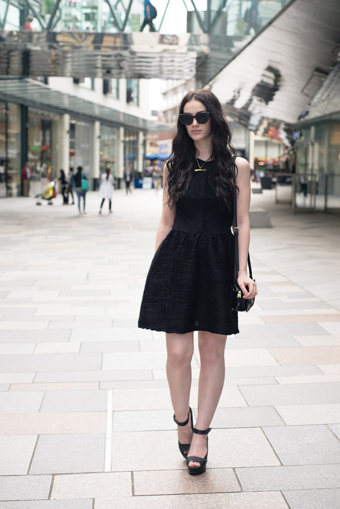 Fashion blogger Stephanie of FAIIINT wearing ASOS cateye sunglasses, Topshop textured skater dress, Nica Venice crossbody bag, Skin by Finsk wedges, Skin by Nair. Casual summer all black street style outfit.