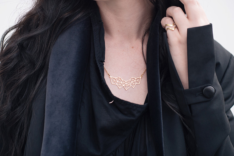 Fashion blogger Stephanie of FAIIINT wearing A Weathered Penny gold geometric necklace and brass arrow ring. Details.