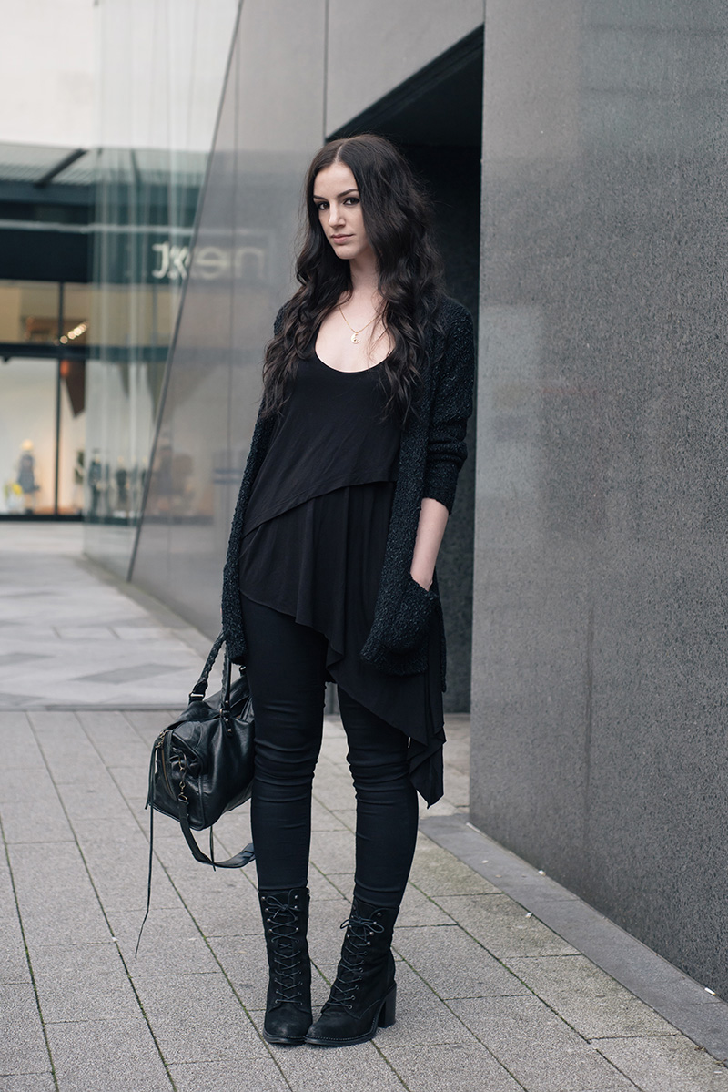 Fashion blogger Stephanie of FAIIINT wearing George at ASDA textured chunky cardigan & Wonderfit skinny jeans, FAIIINT Splice tank top, Kurt Geiger Saturn boots & Balenciaga city bag. All black everything dark style casual outfit.