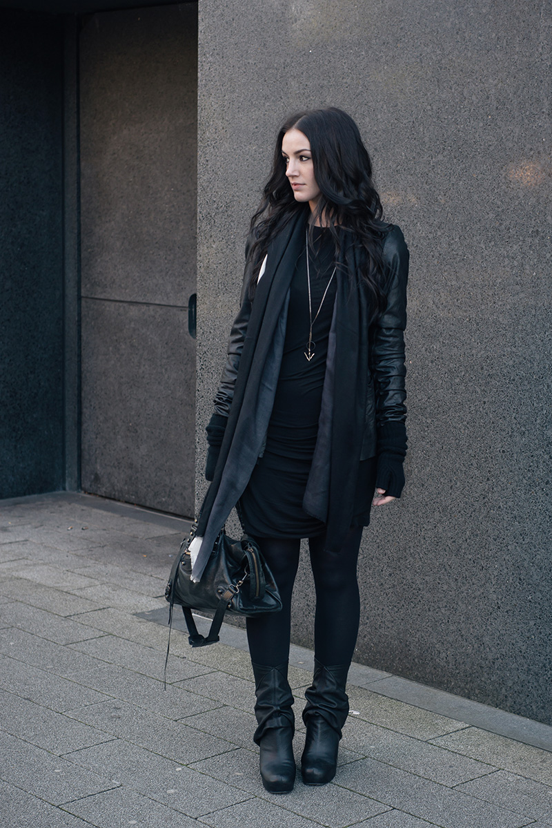Fashion blogger Stephanie of FAIIINT wearing Rick Owens leather jacket & peaked back wedge boots, Black.co.uk ombre fade cashmere scarf & cashmere knit wrist warmer gloves, H&M dress, Hvnter Gvtherer necklace, Balenciaga city bag. All black everything dark street style winter outfit.