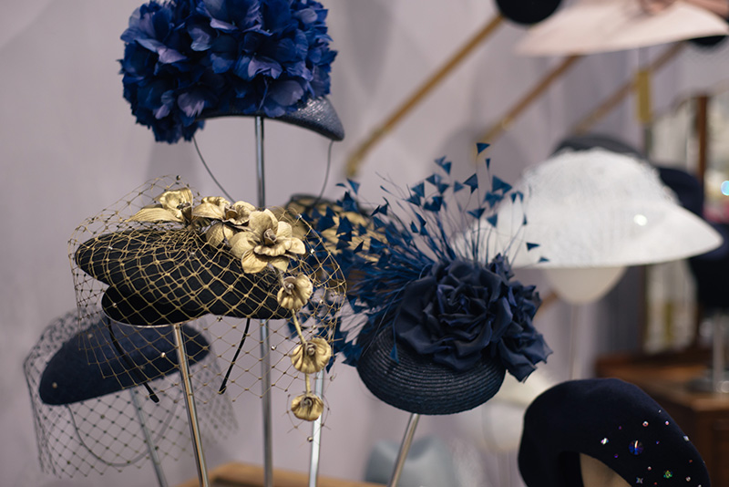 FAIIINT Milliner William Chambers hat shop in Glasgow. Gold and navy blue flowers wedding hats.