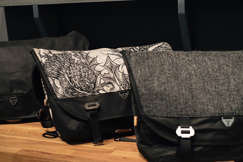 FAIIINT Trakke Glasgow studio. Wee Lug and Bairn waxed cotton and Harris Tweed messenger bags with Timorous Beasties thistle print.