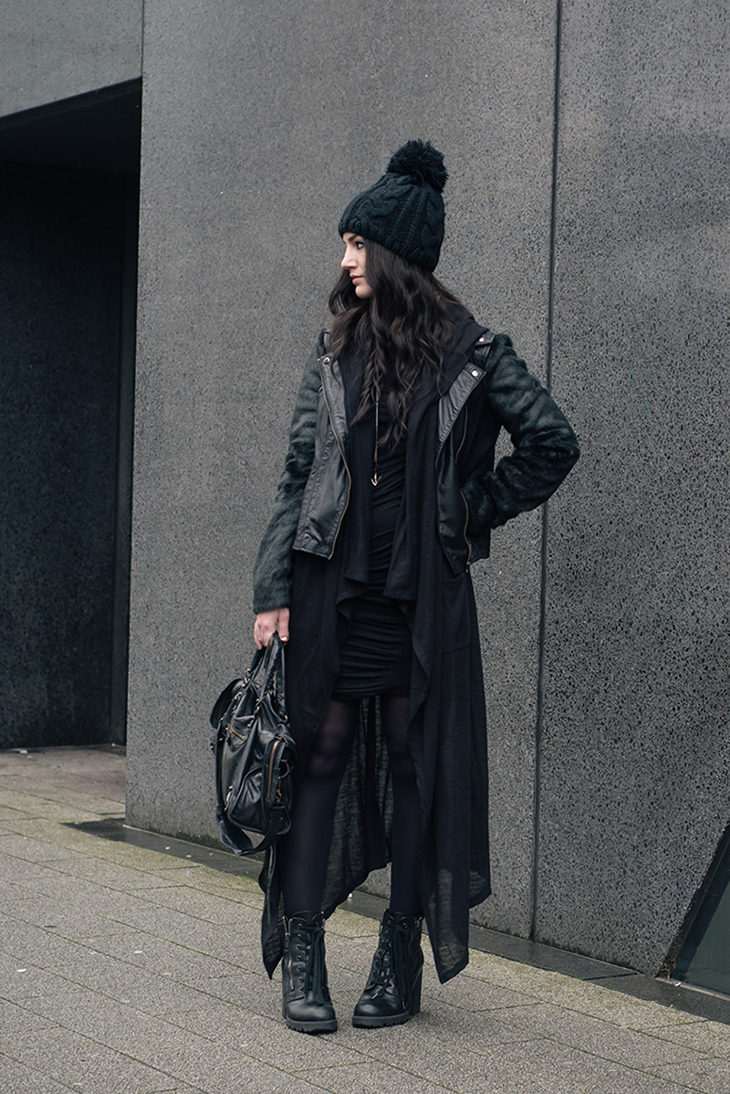 Fashion blogger Stephanie of FAIIINT wearing OASAP Beanie, ASOS faux fur and leather biker jacket, H&M draped maxi cardigan, Vila dress, ASH Poker boots, Balenciaga city bag. All black everything dark street style casual goth outfit.