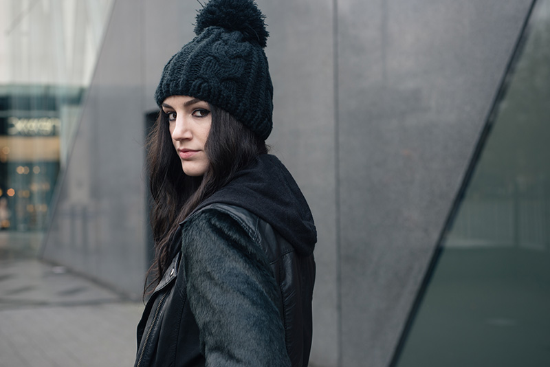 Fashion blogger Stephanie of FAIIINT wearing OASAP Beanie, ASOS faux fur and leather biker jacket, H&M draped maxi cardigan with hood. All black outfit details.
