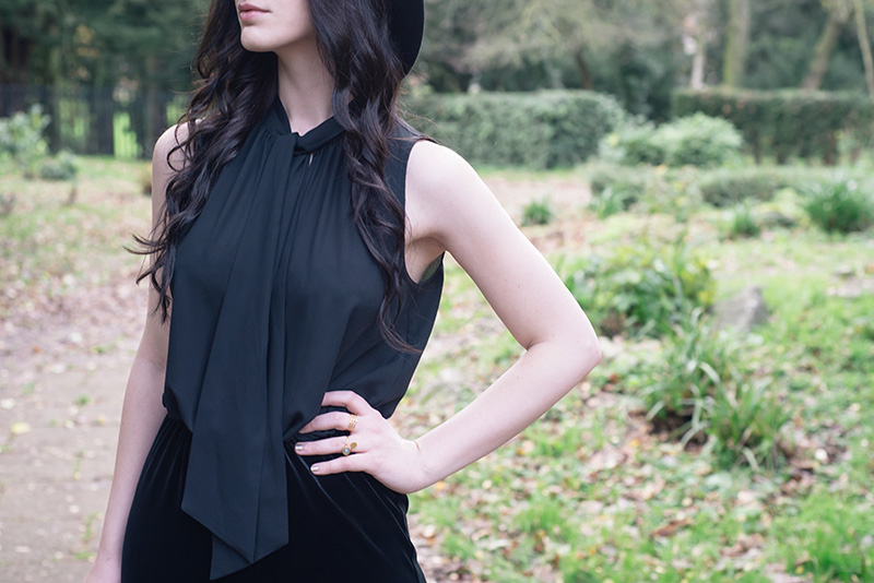Fashion blogger Stephanie of FAIIINT wearing F&F chiffon and velvet black tie neck jumpsuit. Outfit details.