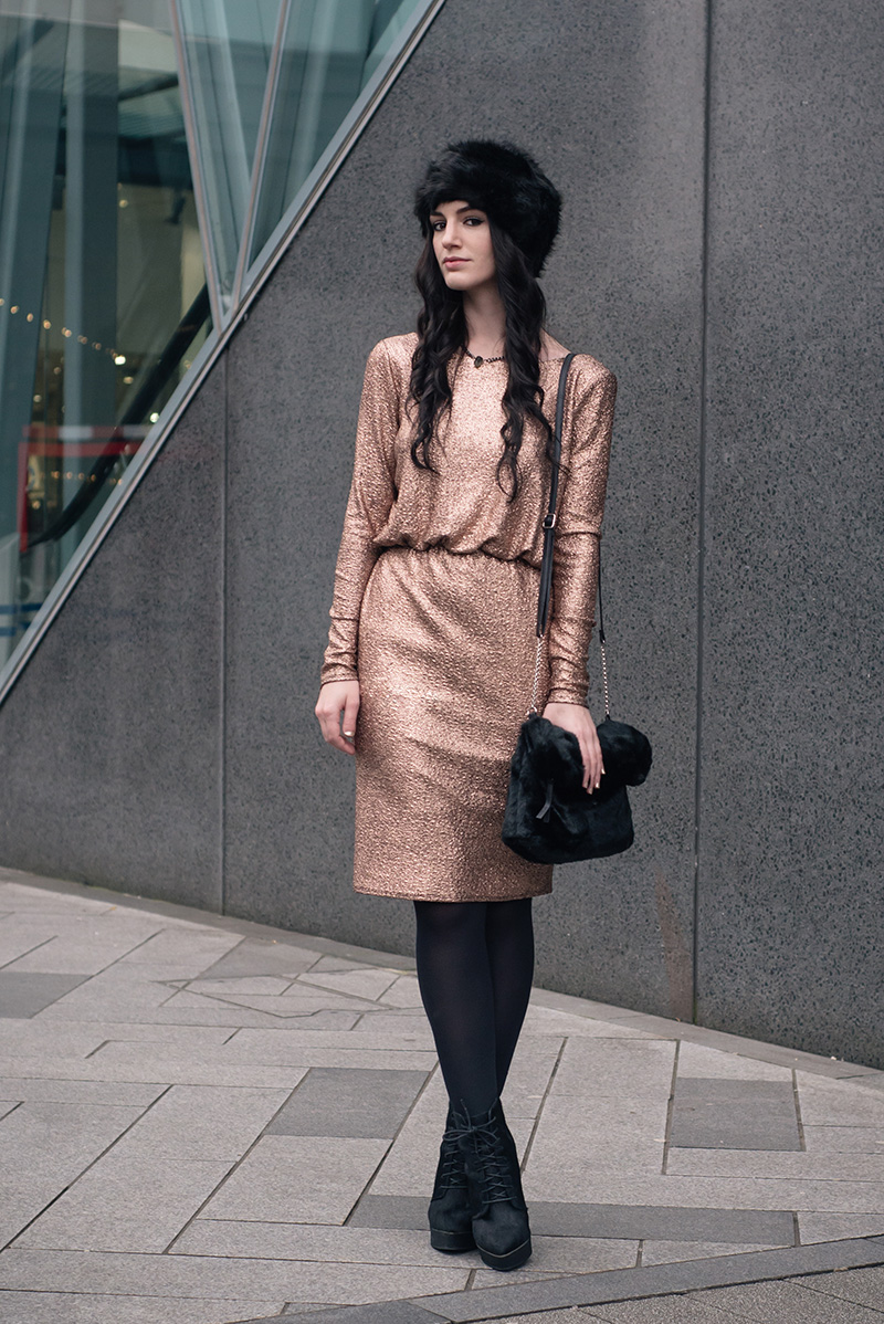 Fashion blogger Stephanie of FAIIINT wearing F&F at Tesco gold foil metallic dress, black faux fur hat and faux fur clutch bag, Kurt Geiger ponyhair wedge boots, Regal Rose labradorite choker. Dark street style christmas party winter outfit.