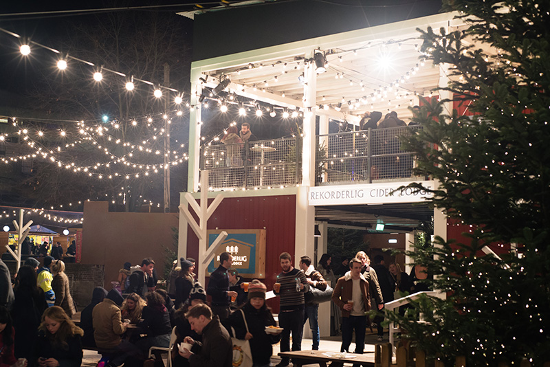 FAIIINT Rekorderlig Cider Lodge Southbank London at Winter Christmas time. Fairy lights outside.
