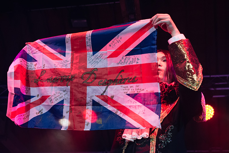 Hyper Japan Christmas Market 2015 at Tobacco Dock London. Lacroix Despheres performing live holding British UK flag.