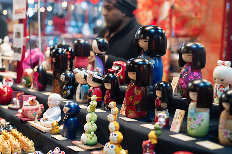 Hyper Japan Christmas Market 2015 at Tobacco Dock London. Traditional Japanese Kokeshi dolls.