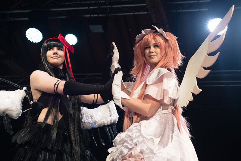 Hyper Japan Christmas Market 2015 at Tobacco Dock London. Cosparade cosplay Goddess Madoka and Homura Akemi from Puella Magi.