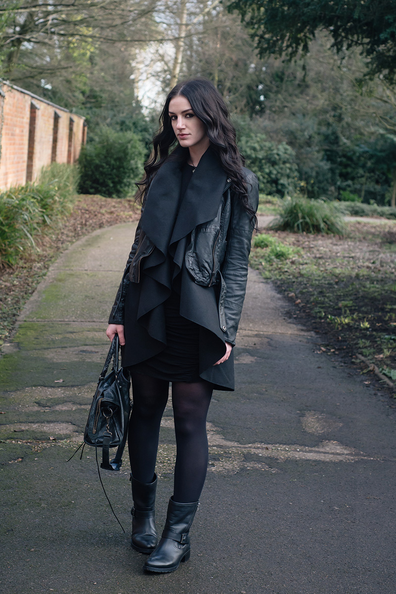 Fashion blogger Stephanie of FAIIINT wearing MuuBaa leather biker jacket, SheIn draped waistcoat, ASOS dress, Elemental Luxury quartz necklace, Jones Bootmaker Yazmin biker boots, Balenciaga city bag. Casual all black everything street style outfit.