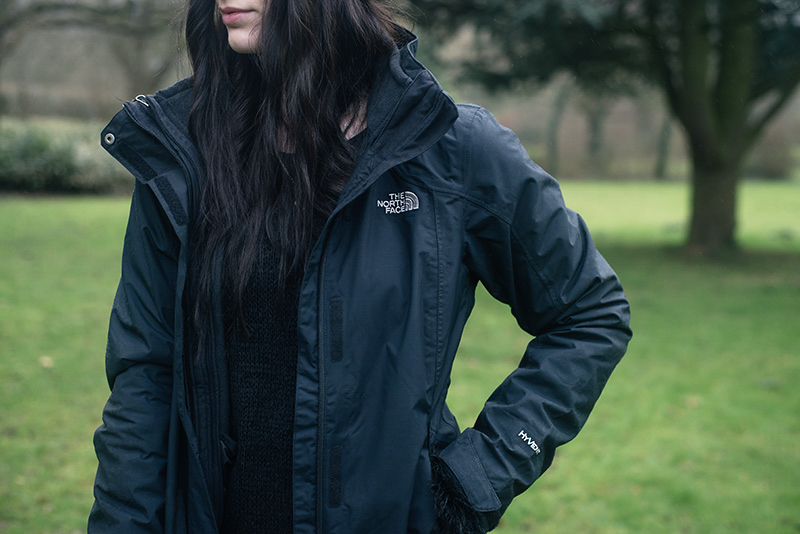 Fashion blogger Stephanie of FAIIINT wearing The North Face Evolution TriClimate 3 in 1 HyVent jacket. All black everything dark style winter dog walking outfit details.
