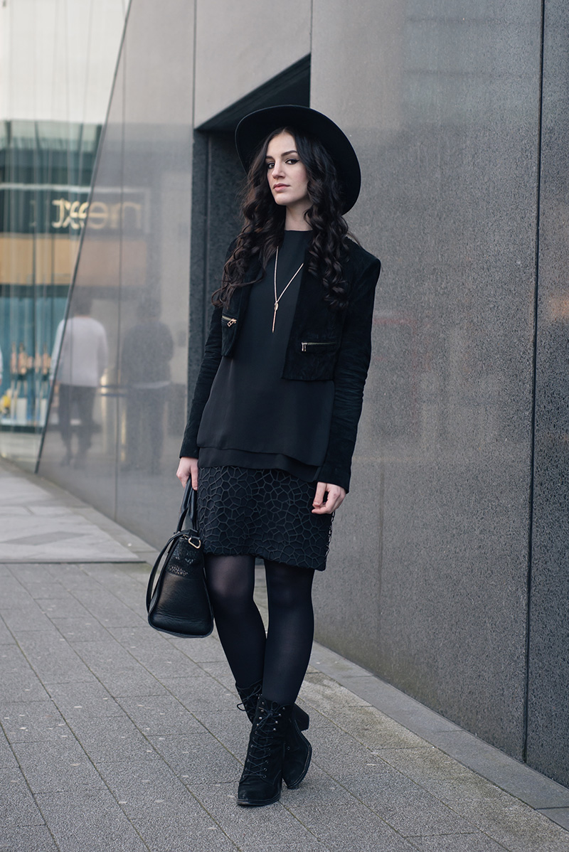 Fashion blogger Stephanie of FAIIINT wearing Catarzi wide brim fedora hat, Topshop cropped suede jacket, Reiss Coral overlay shift dress, Kurt Geiger Saturn boots. All black everything dark street style outfit.