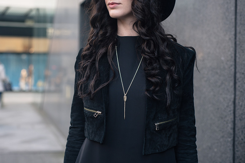 Fashion blogger Stephanie of FAIIINT wearing Topshop cropped suede jacket, Bloody Mary Metal Lovehunters Arrow silver necklace. All black everything outfit details.