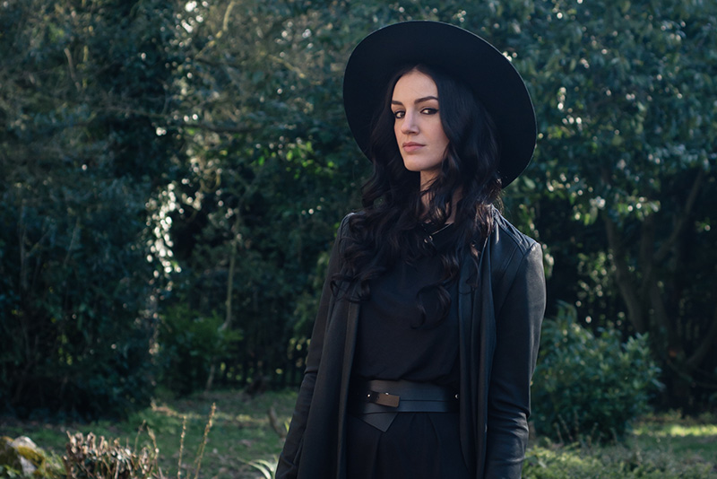 Fashion blogger Stephanie of FAIIINT wearing Warehouse wide brim hat, Barney's Originals draped leather jacket, Vero Moda tee dress, Pieces leather wrap belt. All black everything casual dark street style outfit.