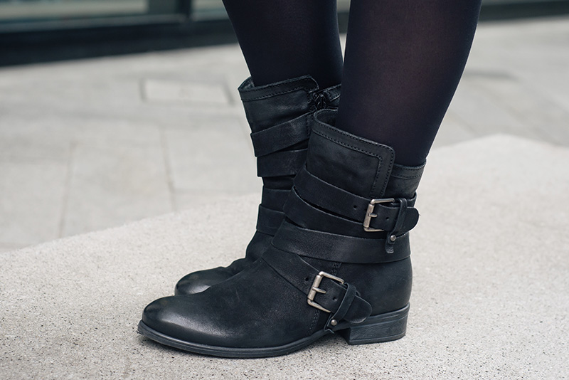 Fashion blogger Stephanie of FAIIINT wearing Daniel Footwear Marvelous black biker strap buckle boots. Outfit details.