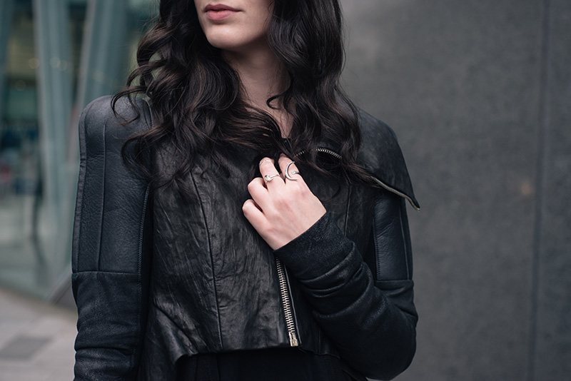 Fashion blogger Stephanie of FAIIINT wearing Rick Owens draped back cropped leather jacket fw10, Wolf + Sadie Theurgy crescent silver ring, Birds N Bones Taxidea silver claw ring and Mus Hip bone knuckle ring. All black everything dark goth street style outfit details.
