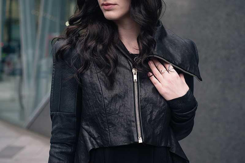 Fashion blogger Stephanie of FAIIINT wearing Rick Owens draped back cropped leather jacket fw10, Wolf + Sadie Theurgy crescent silver ring, Birds N Bones Taxidea silver claw ring and Mus Hip bone knuckle ring. All black everything dark goth street style outfit details.
