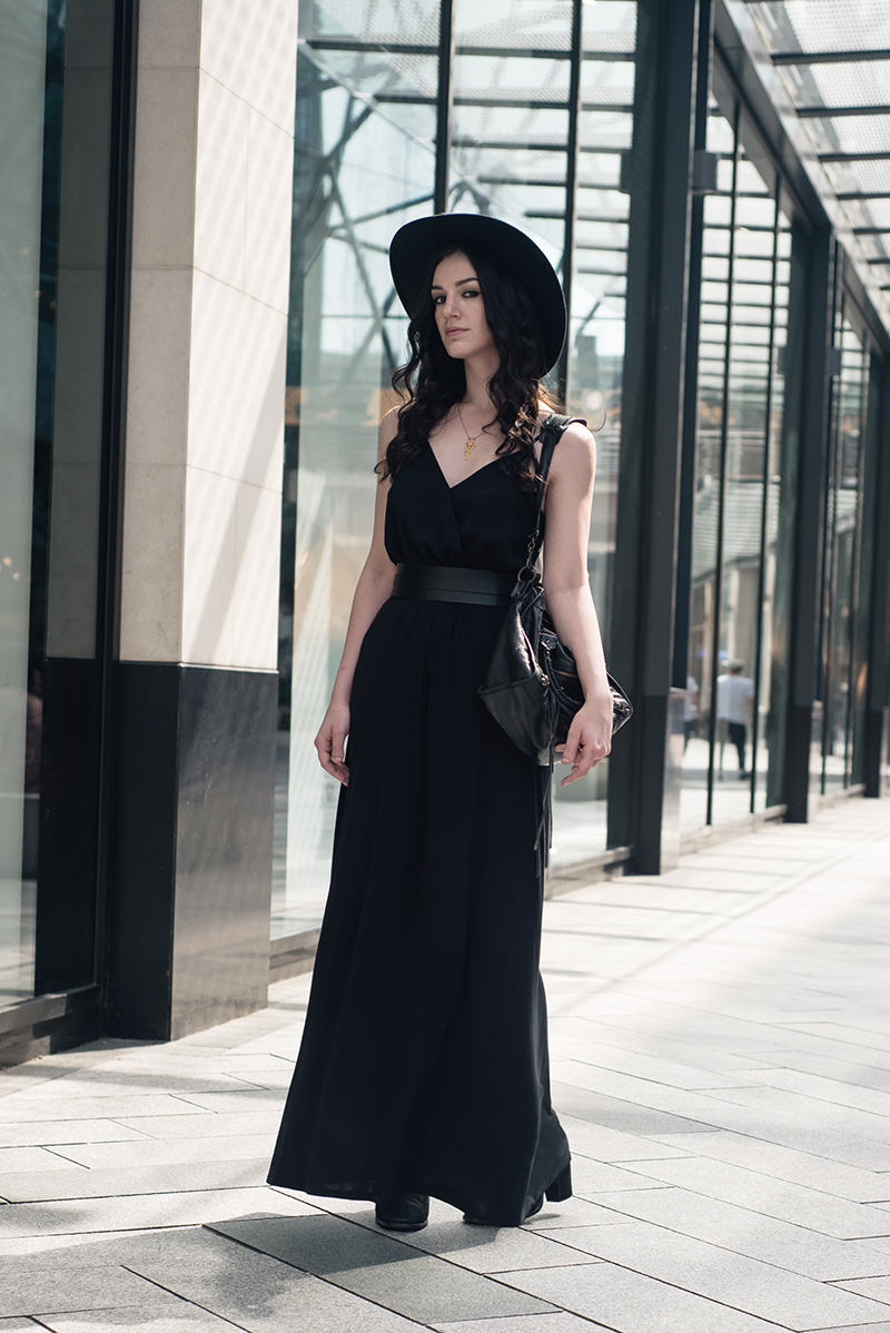 Fashion blogger Stephanie of FAIIINT wearing Catarzi wide brim fedora hat, ASOS wrap cami, New Look maxi skirt, Pieces thick leather waist belt, RockLove chevron necklace, Balenciaga city bag. All black everything summer goth dark street style outfit.