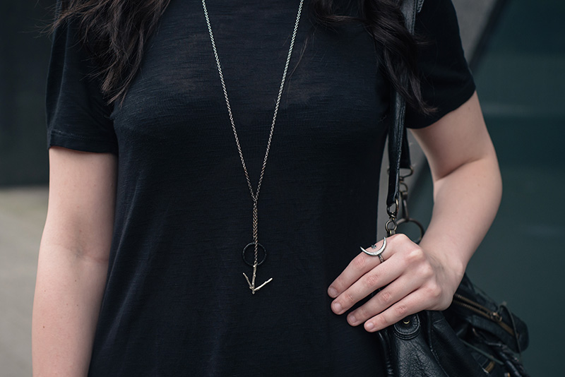 Fashion blogger Stephanie of FAIIINT wearing H&M asymmetric tee shirt, Hvnter Gatherer Lacustrine necklace, Wolf + Sadie Theurgy silver ring, Balenciaga city bag. All black everything outfit details.