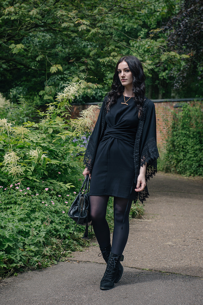 Fashion blogger Stephanie of FAIIINT wearing Blue Vanilla New Look Lace trim draped kimono, ASOS wrap knot dress, Sara Gunn gold bone necklace, Kurt Geiger Saturn boots, Balenciaga city bag. All black everything dark gothic witchy style outfit.