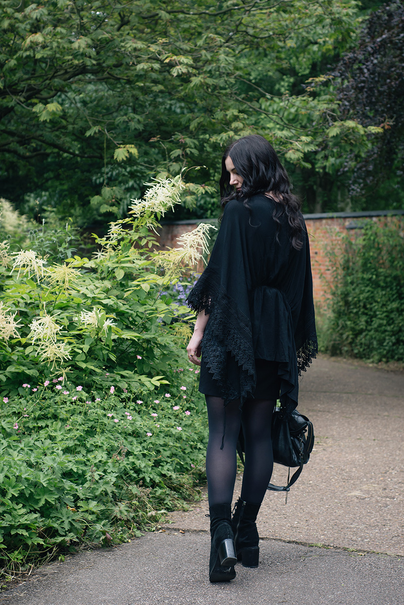 Fashion blogger Stephanie of FAIIINT wearing Blue Vanilla New Look Lace trim draped kimono, ASOS wrap knot dress, Sara Gunn gold bone necklace, Kurt Geiger Saturn boots, Balenciaga city bag. All black everything dark gothic witchy style outfit.