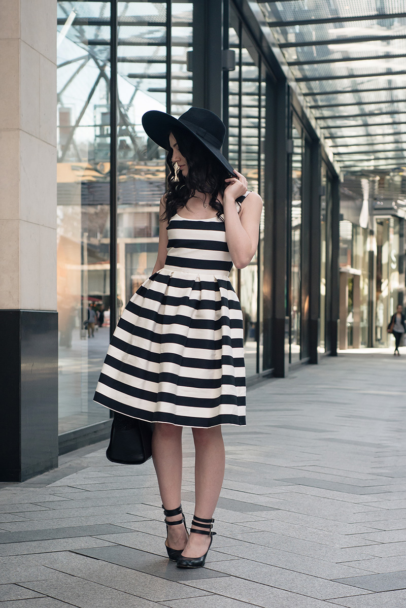 Fashion blogger Stephanie of FAIIINT wearing Warehouse black and white bold striped dress, H&M wide brim fedora, Vivienne Westwood animal toe mary jane shoes. Summer goth vintage street style outfit.