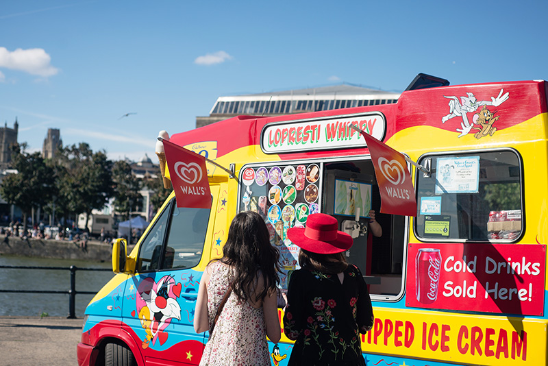 Bristol harbour girls getting ice cream cones from ice cream truck.