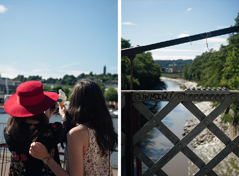 Bristol bridge landscape. Girls taking instagram photo of ice cream.
