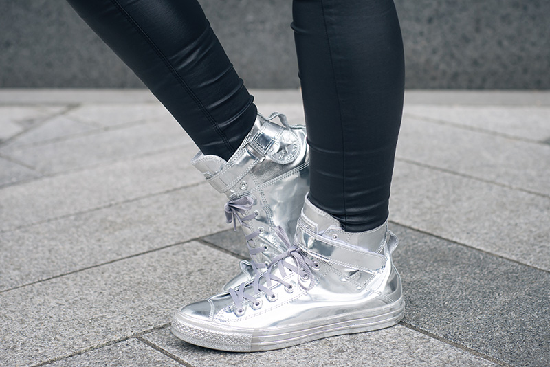 Fashion blogger Stephanie of FAIIINT wearing Converse Chuck Taylor All Star Brea chrome silver high top sneakers. Street style outfit details.