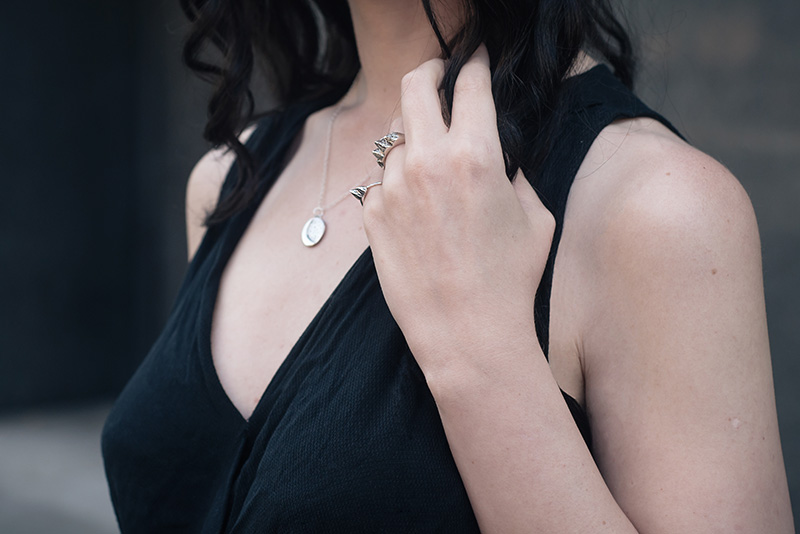 Fashion blogger Stephanie of FAIIINT wearing Ailsigr silver statement mountain rings and cresecent moon and stars necklace. Outfit details.