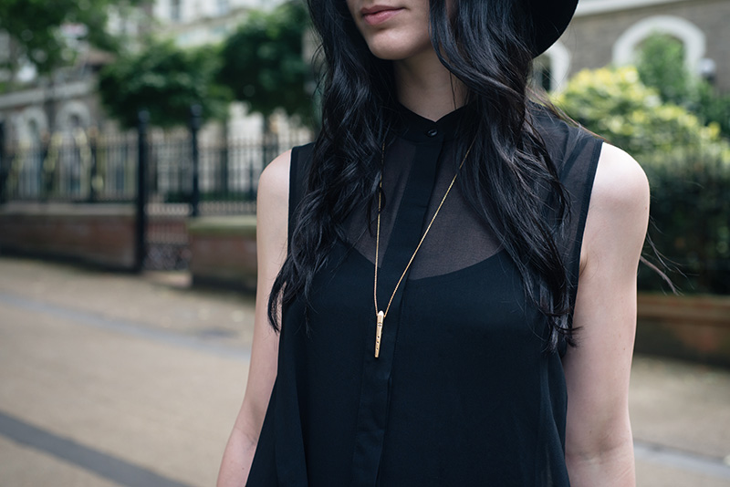 Fashion blogger Stephanie of FAIIINT wearing Ailsigr gold symbols talisman pendant necklace. Outfit details.