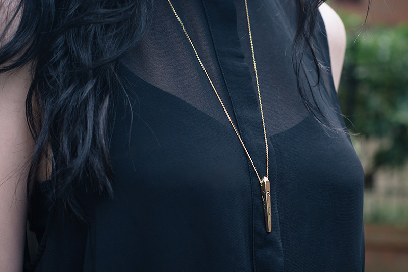 Fashion blogger Stephanie of FAIIINT wearing Ailsigr gold symbols talisman pendant necklace. Outfit details.