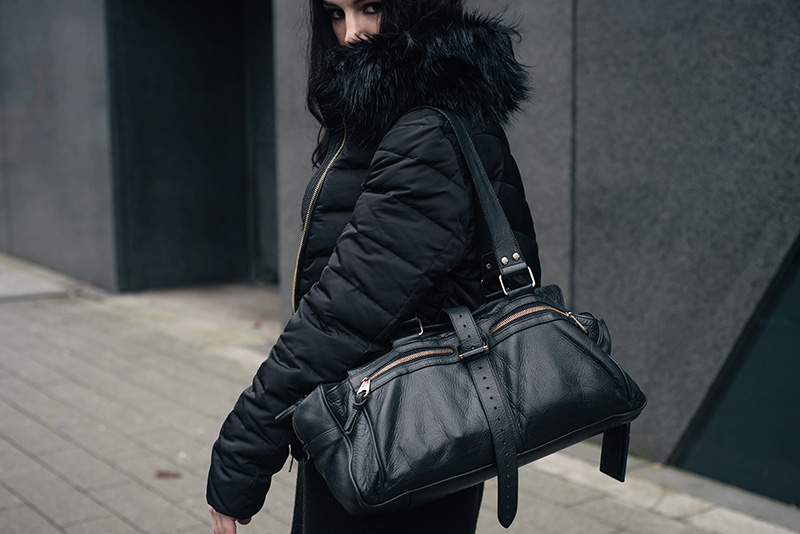 Fashion blogger Stephanie of FAIIINT wearing H&M quilted padded down jacket with faux fur collar, Mulberry Mabel bag. All black winter street style outfit details.