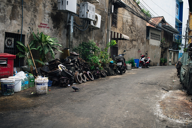Bangkok Thailand Chinatown city streets with motorbikes, engines, spare parts and machinery.