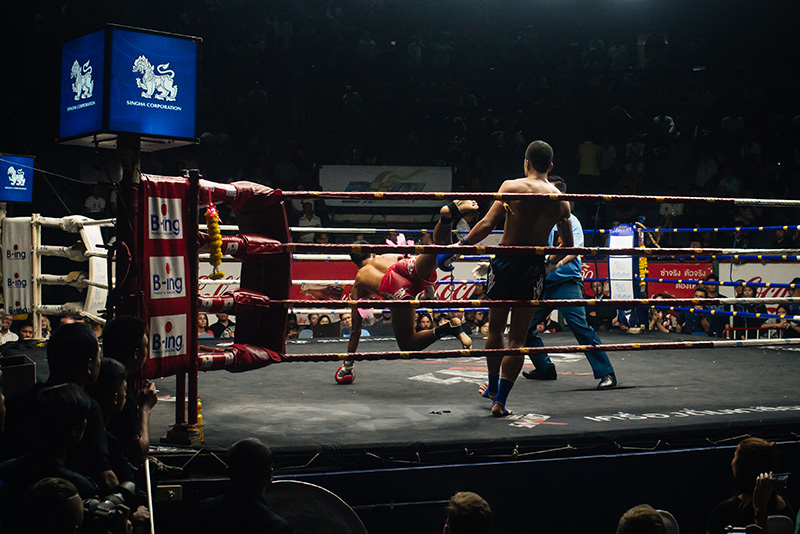 Bangkok Thailand Muay Thai fight knock down in the ring at Rajadamnern Stadium.