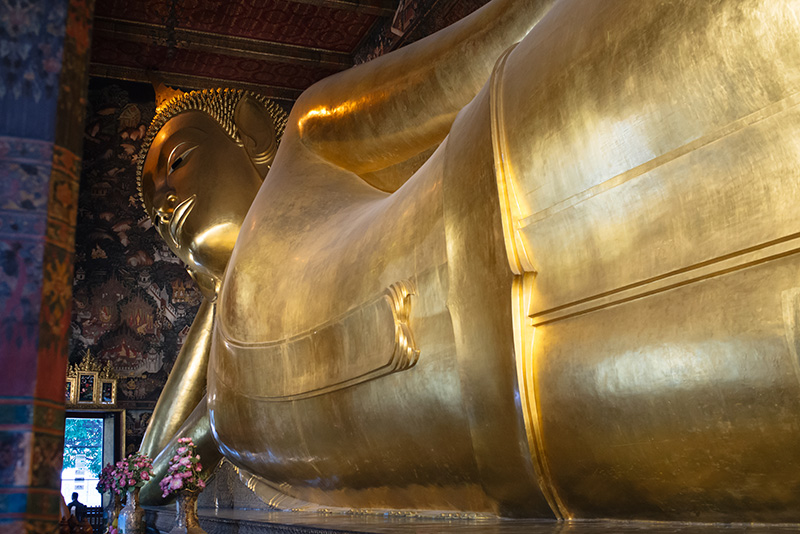 Temples of Bangkok Thailand, Wat Pho gold reclining Buddha statue at the Temple of The Reclining Buddha.