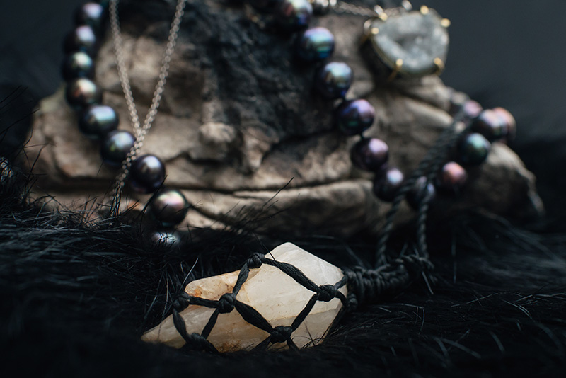 FAIIINT jewellery picked up from travelling Thailand, Cambodia and China. Pale blue topaz druzy silver necklace, black rainbow pearls, milky white and orange quartz handmade wrapped raw crystal.