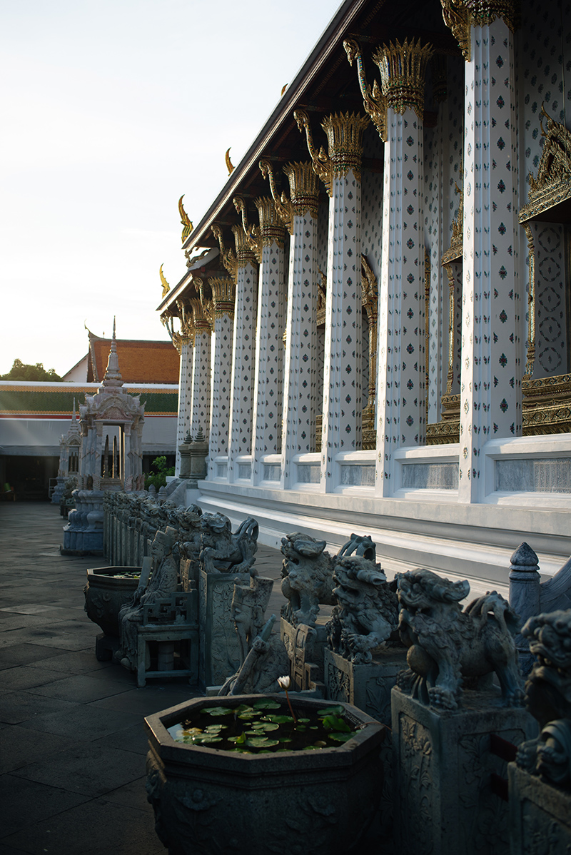 Temples of Bangkok Thailand, Wat Arun the Temple of Dawn at golden hour sunlight.