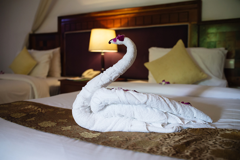 Sokhalay Angkor Villa Resort in Siem Reap Cambodia, room and bed with towel swan.