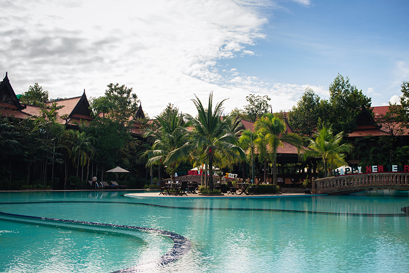 Sokhalay Angkor Villa Resort in Siem Reap Cambodia, tropical pool area with palm trees.