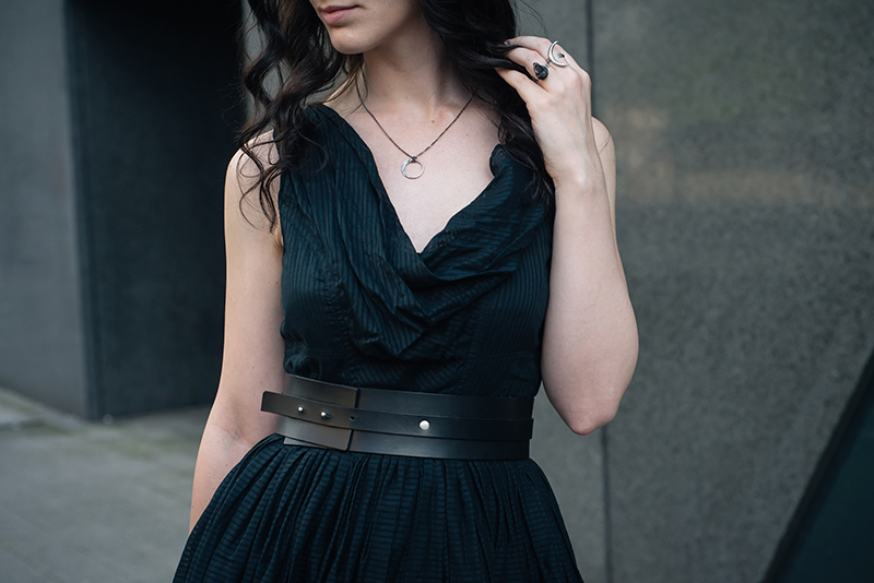 Fashion blogger Stephanie of FAIIINT wearing All Saints dress, Pieces wide leather waist belt, Wolf + Sadie Lucid Petite silver necklace and Theurgy claw ring, Elemental Luxury raw phantom quartz ring. All black outfit details.