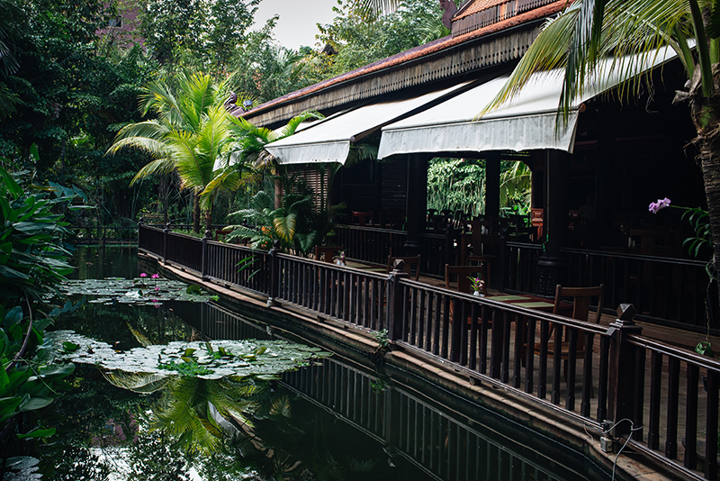 Sokhalay Angkor Villa Resort in Siem Reap Cambodia, dining area next to pond with lily pads.