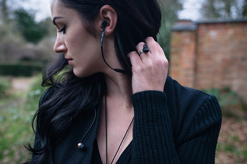 Fashion blogger Stephanie of FAIIINT wearing H&M Draped coat jacket, River Island draped top, Sudio Sweden wireless bluetooth headphones. All black everything dark style outfit details.