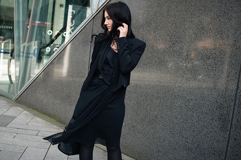Fashion blogger Stephanie of FAIIINT wearing Theyskens' Theory cropped tailored jacket, River Island draped chiffon dress. All black everything dark street style outfit.