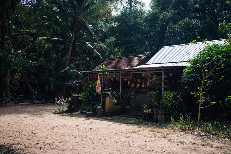 Siem Reap countryside in Cambodia, local shop with Cambodian flags.