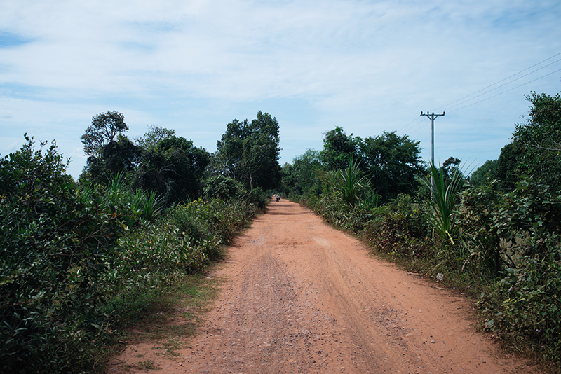 Countryside landscape in Siem Reap Cambodia, dusty red orange roads..
