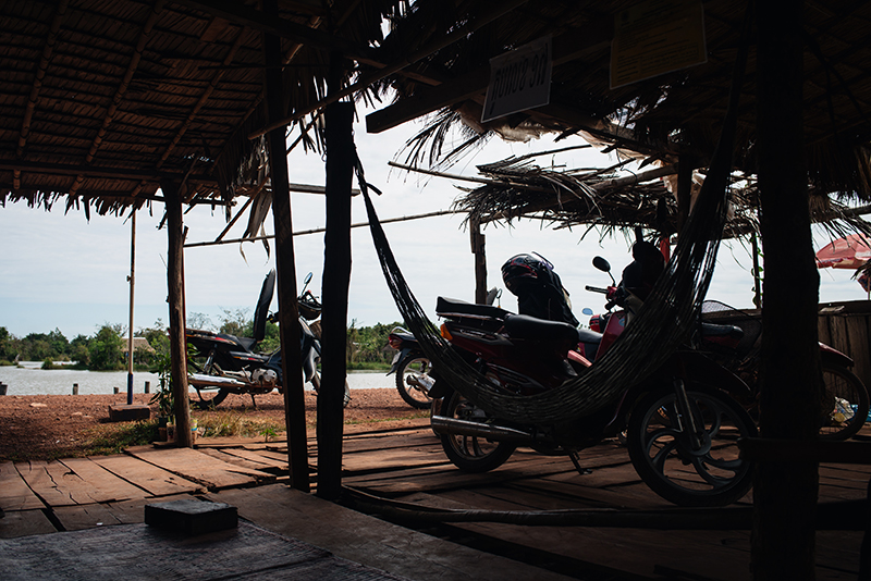 Motorbiking through the Siem Reap countryside in Cambodia on a Honda Dream with Khmer Ways, roadside stop.
