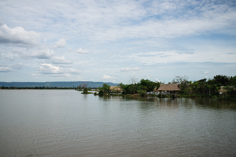 Countryside landscape in Siem Reap Cambodia, reservoir with wooden shelters.